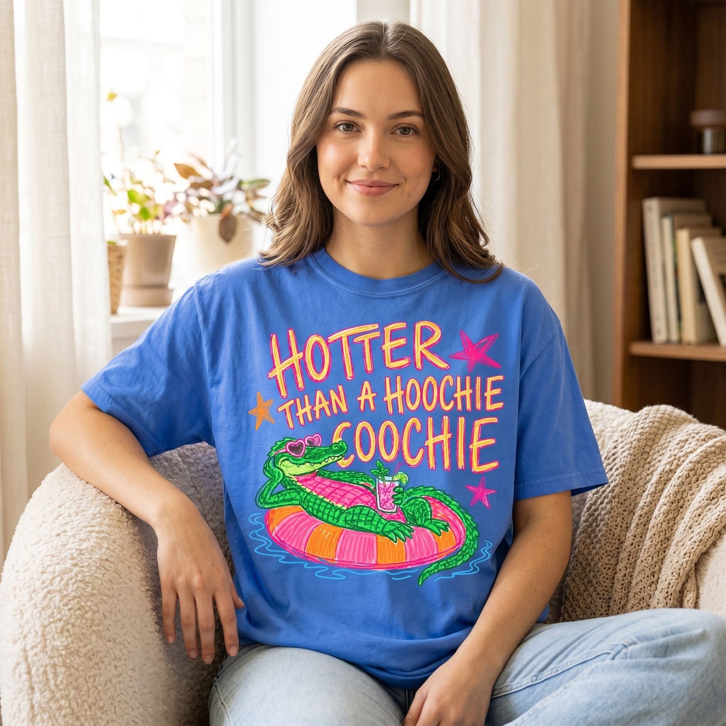 Front view of fiery gator graphic tee worn by a model in a cozy living room setting with warm natural light.