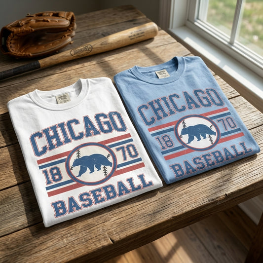 Close-up of Chicago 1870 Baseball Comfort Colors T-shirt showing soft, broken-in fabric, vintage print, and subtle texture on wooden surface.