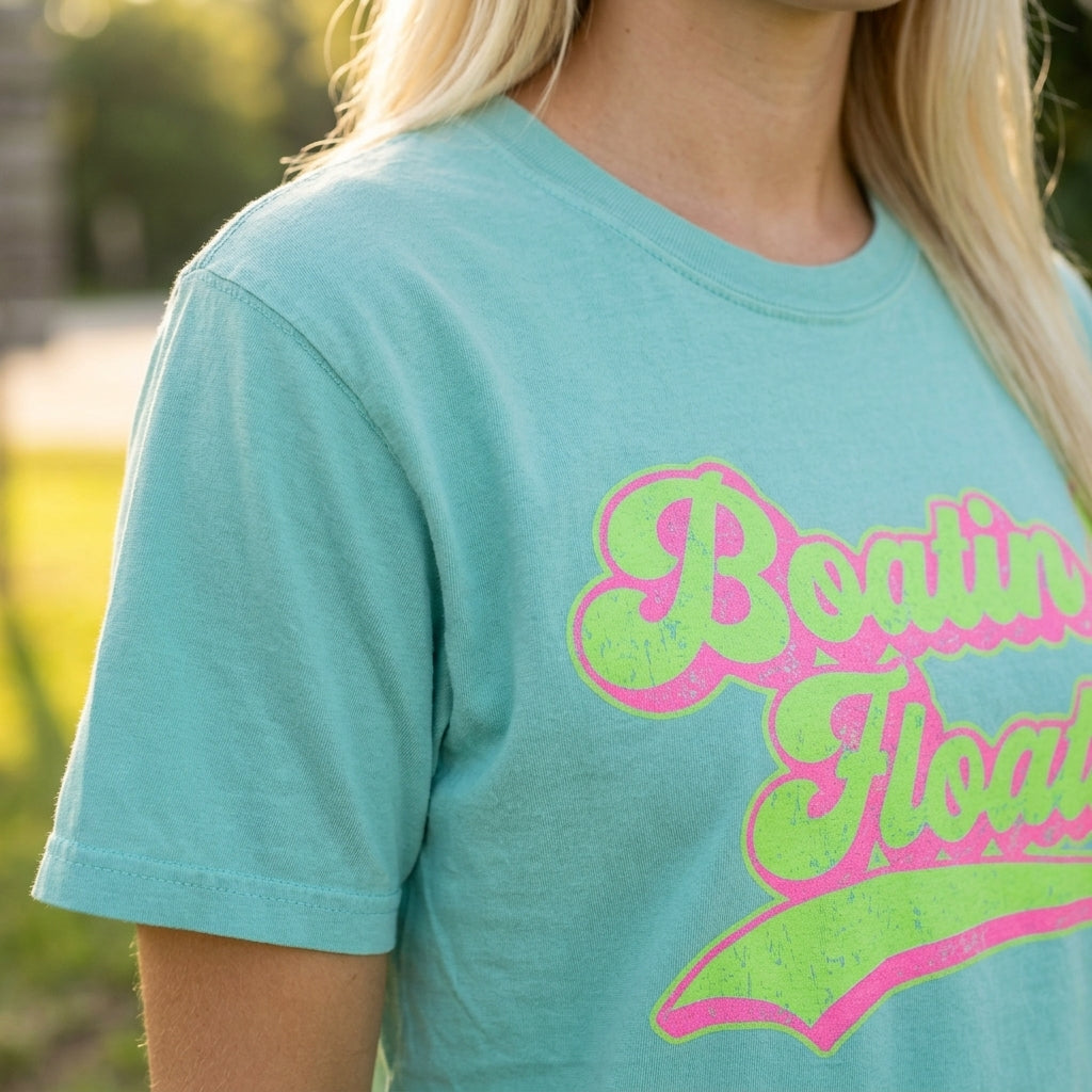 Close-up of Boatin and Floatin Tee highlighting fabric texture, stitching, and detailed weave in outdoor natural daylight.
