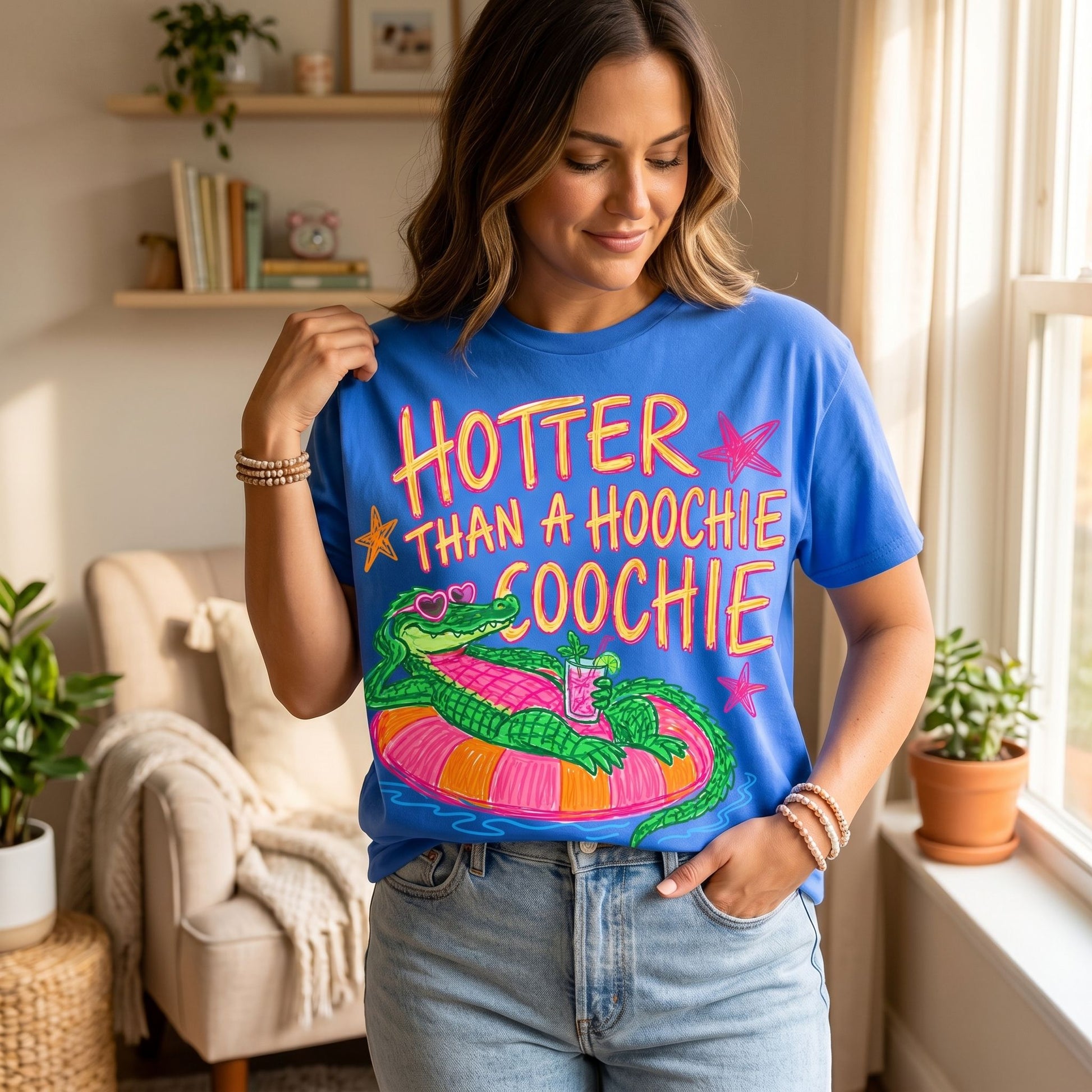 Full-body view of a model in a cozy cafe wearing the bold graphic tee, showcasing natural pose and inviting lighting.