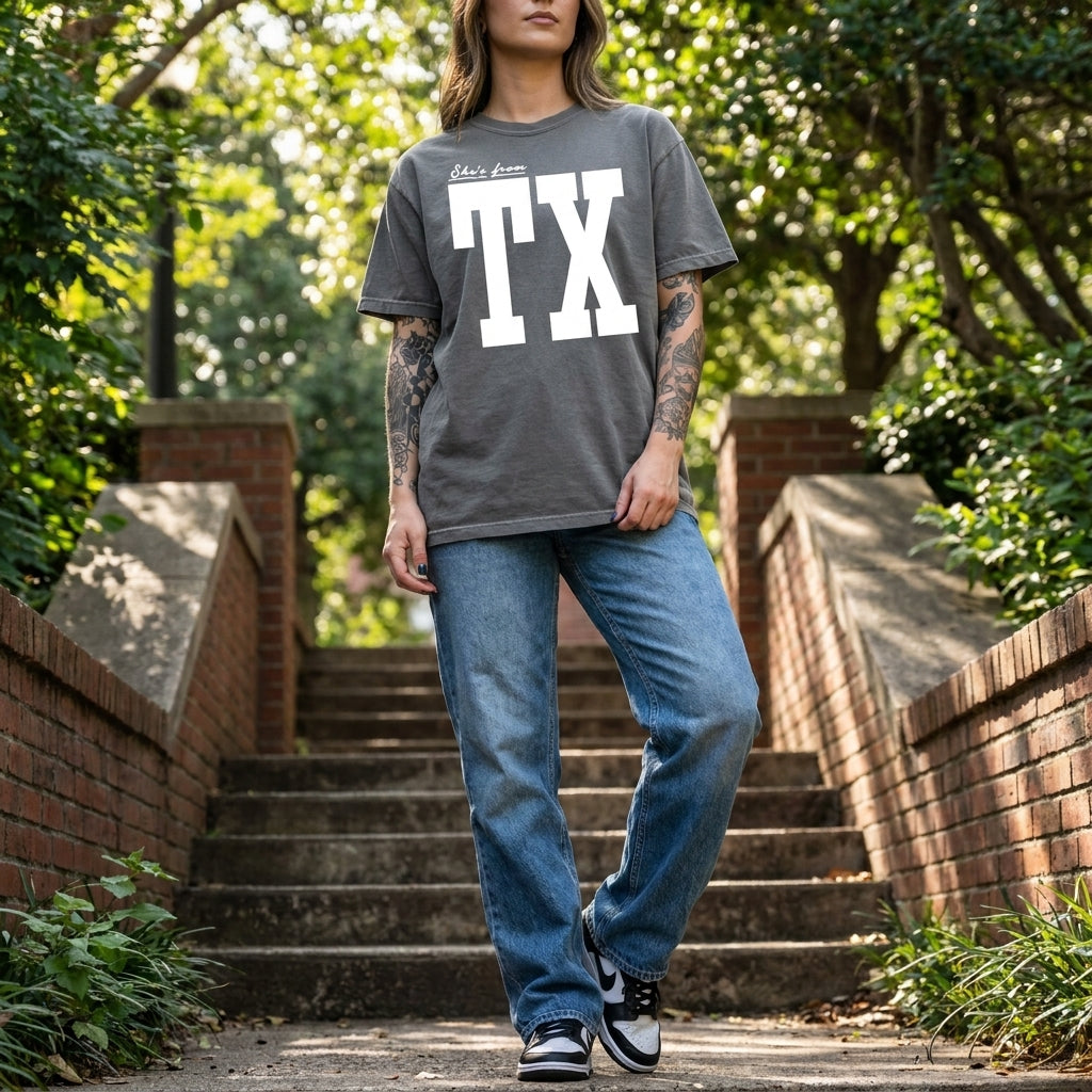 Model wearing a Custom State Pride T-Shirt in an urban outdoor setting showcasing its relaxed fit and vintage fabric texture.