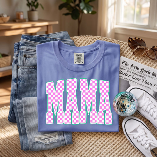Comfort Colors Mama T-shirt displayed by a mom in a cozy cafe setting, highlighting stylish and comfortable design for moms.