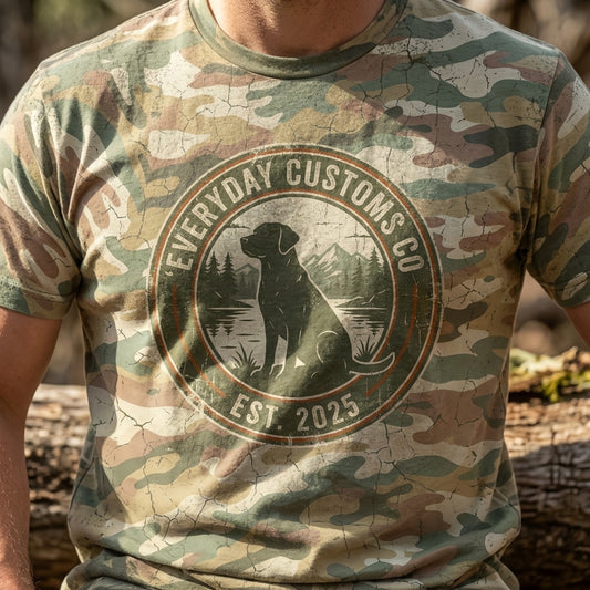 Close-up of the Vintage Camo Southern Dog Graphic Tee showing distressed camouflage pattern and graphic details in natural outdoor lighting.